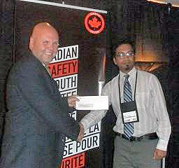 Rajib Sahaji accepts the third place prize