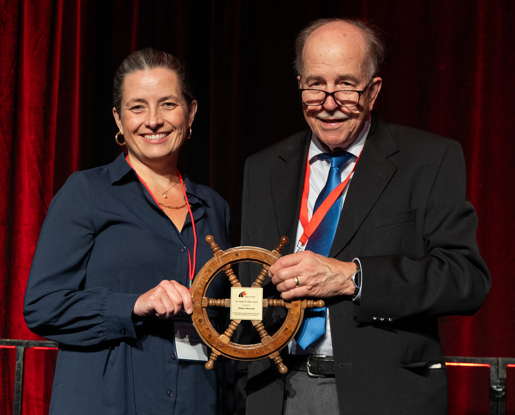 Dr. Brian Jonah, presenting the Charles H. Miller Award to Hillary Maxwell